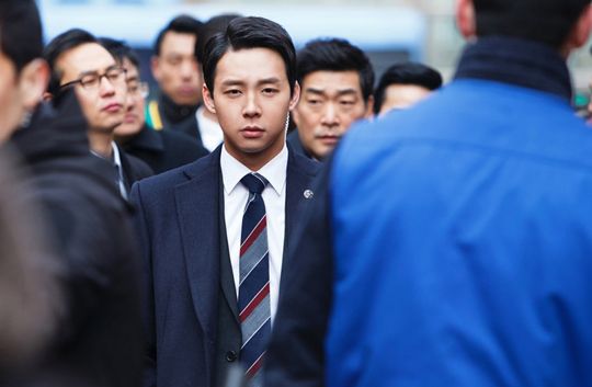 Yoochun as presidential bodyguard in Three Days